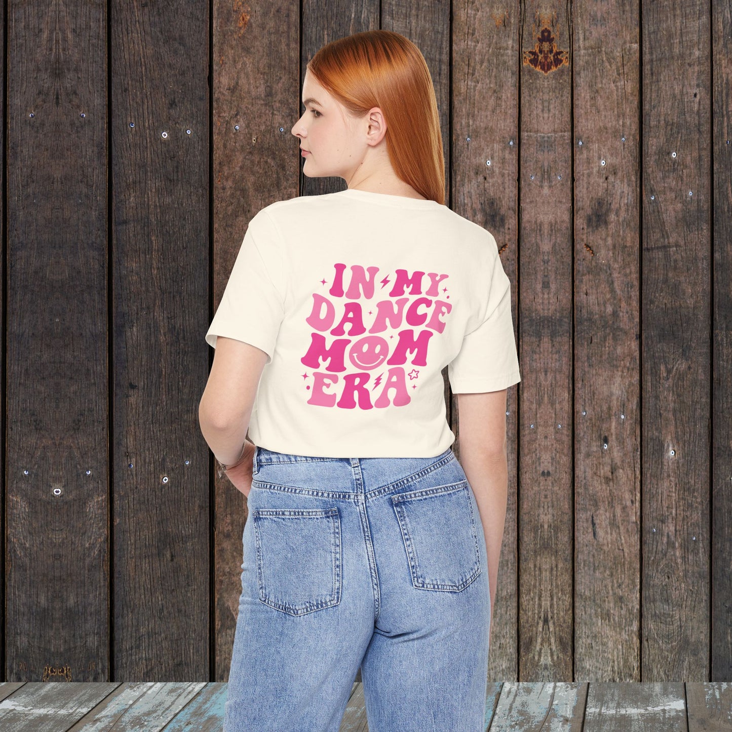 In my Dance mom era retro wavy Pink with happy face mom shirt